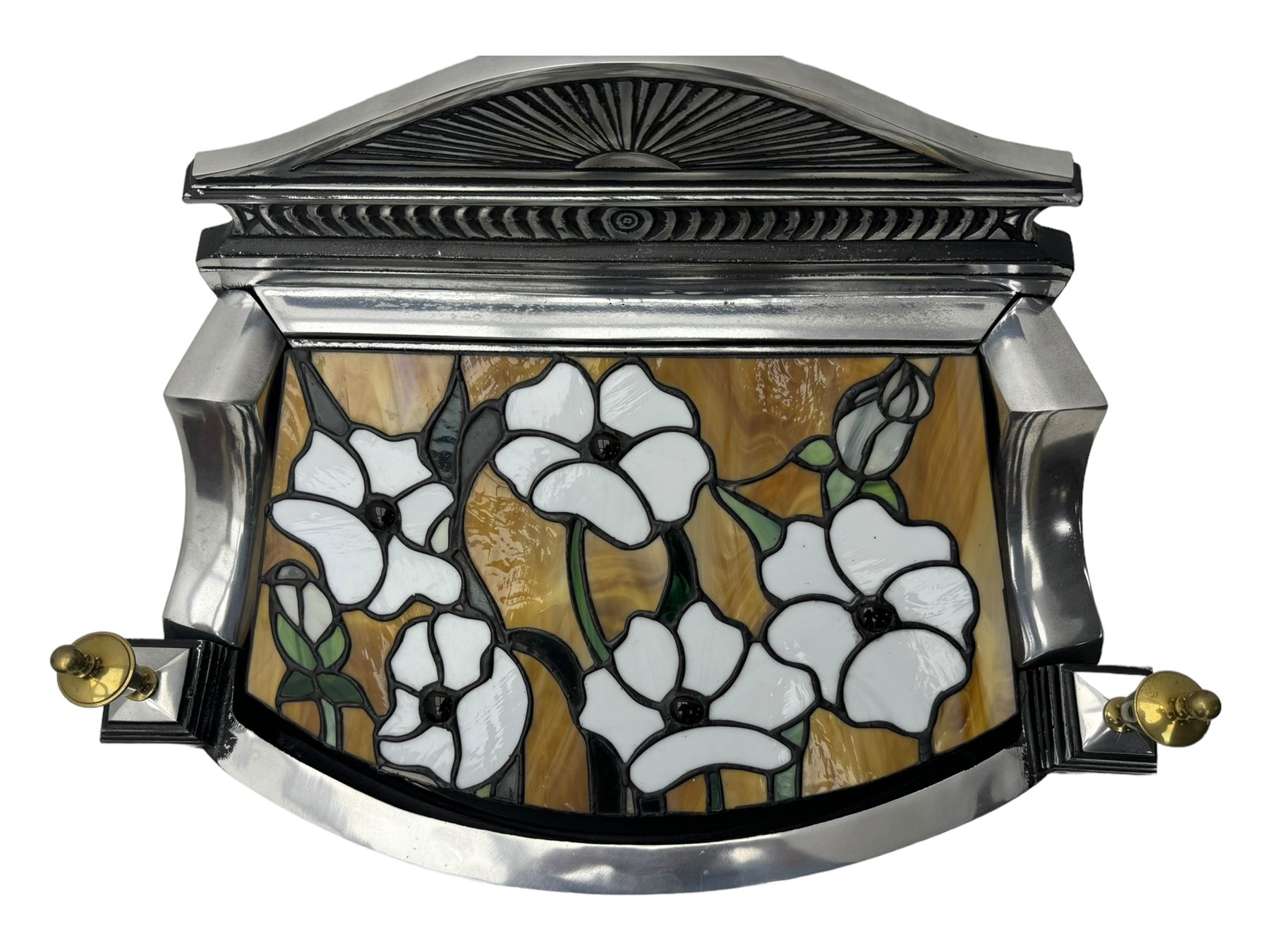 Stained glass and cast iron electric fireplace, arched top with decorative finials, stained glass front panel with floral motifs, flanked by cast iron scrolls, raised on scroll supports