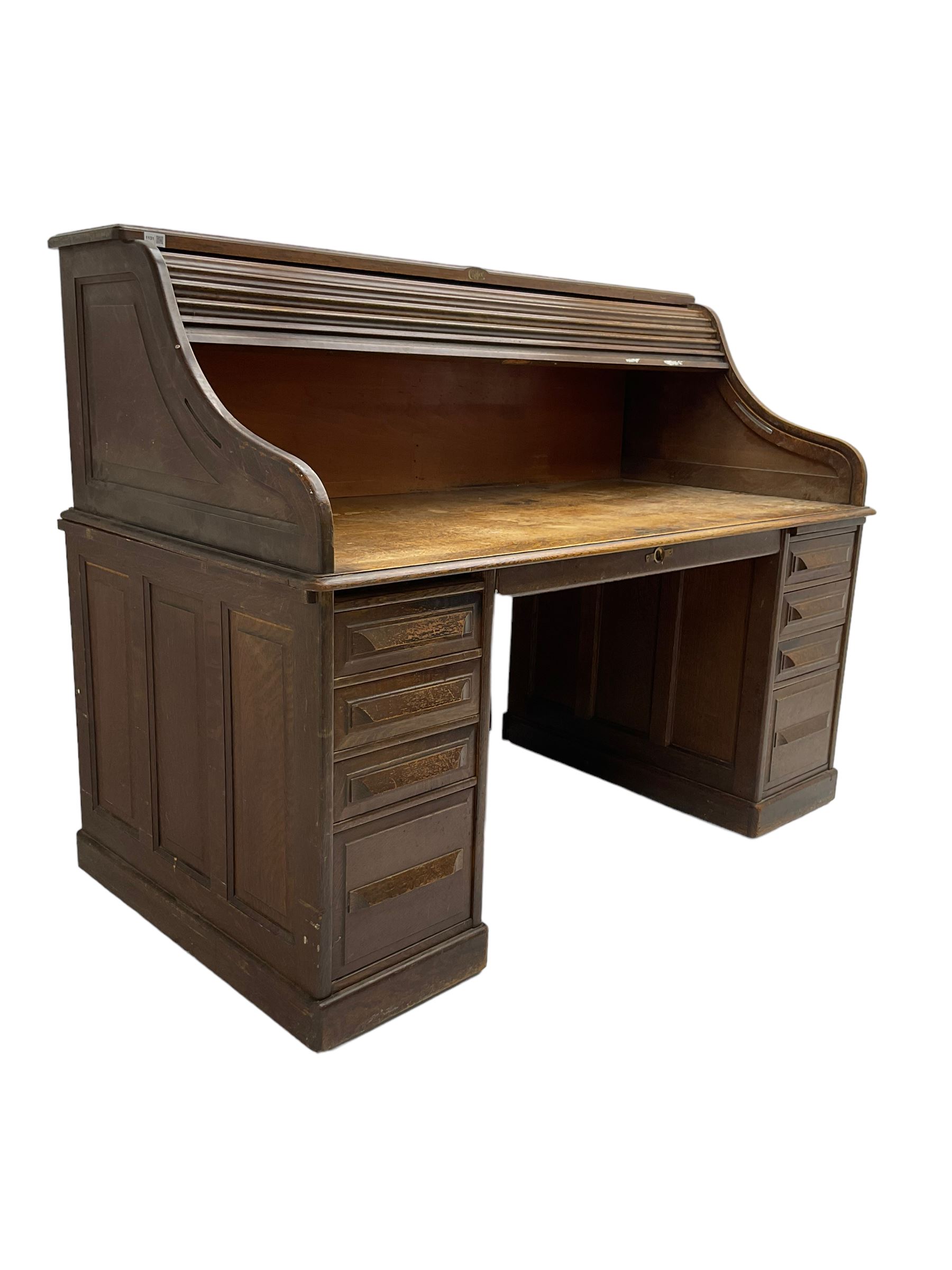 Cutler - early 20th century American oak tambour roll-top desk, the twin pedestals fitted with four graduating drawers