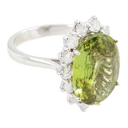 18ct white gold alexandrite and diamond cluster ring, the natural oval cut green alexandrite of approx 5.95 carat, surrounded by fourteen round brilliant cut diamonds, stamped 750, total diamond weight approx 0.80 carat