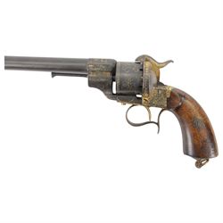 French six shot percussion and pinfire revolver, round barrel 2cm, numbered 1 F 75344 beneath and Brevete Paris on the other side, cylinder and frame overlaid with gold vine leaves, tendrils and lines; with ejector rod on the right, plain wooden grip, and lanyard ring
Sold as an exempt item under Section 58 (2) of the 1968 Firearms Act, to be held as a curiosity or ornament