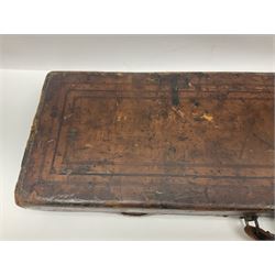 Leather shotgun case, the red baize lined interior with the trade labels of Westley Richards & Co., London, a brass plaque inscribed 'T Nevin, Mirfield, Yorkshire' to cover, with key, case to fit barrel 76cm (30 inches)  
