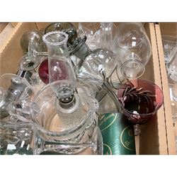 Caithness 'Fireball' paperweight, together with four cased Tyrone Crystal glasses, glass oil lamp, three glass decanters etc, in two boxes
