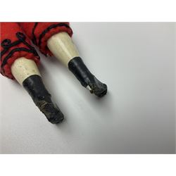  Victorian wax bonnet head doll with moulded red brimmed beret, applied hair and black glass eyes, stuffed body and wooden lower limbs with black painted boots, dressed in red and black trouser suit H31cm