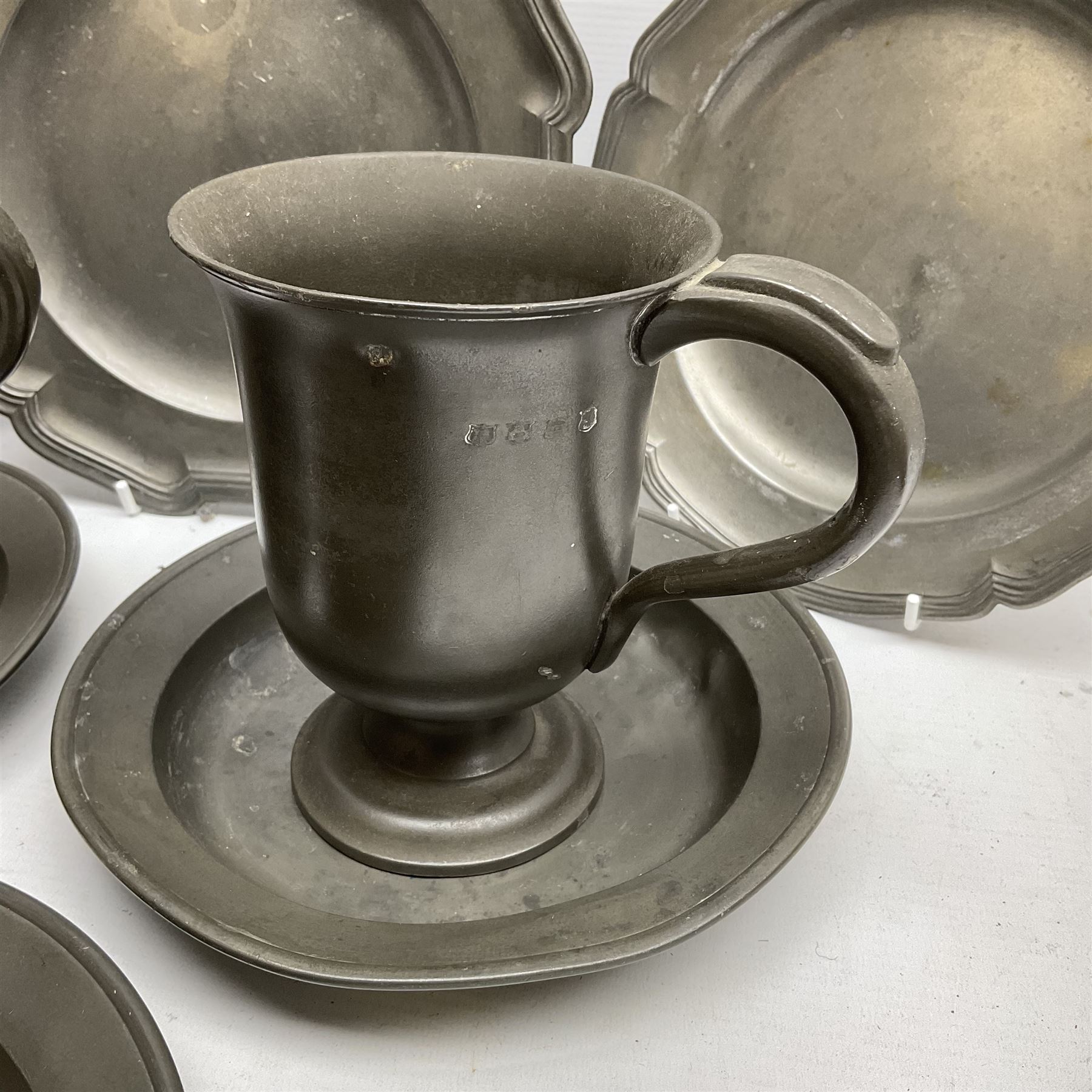 Group of 19th century pewter comprising, set of three H Kamphof Dutch pewter dishes, three other  dishes and two goblets 