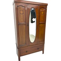 Edwardian inlaid mahogany wardrobe, oval mirror door, single drawer to base