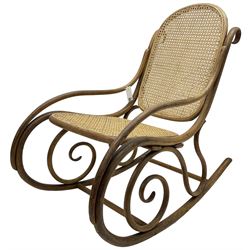 Early 20th century Michael Thonet design bentwood rocking chair, with cane seat and back (W52cm H82cm); Edwardian rocking chair with mauve upholstered back and seat (W43cm H70cm)