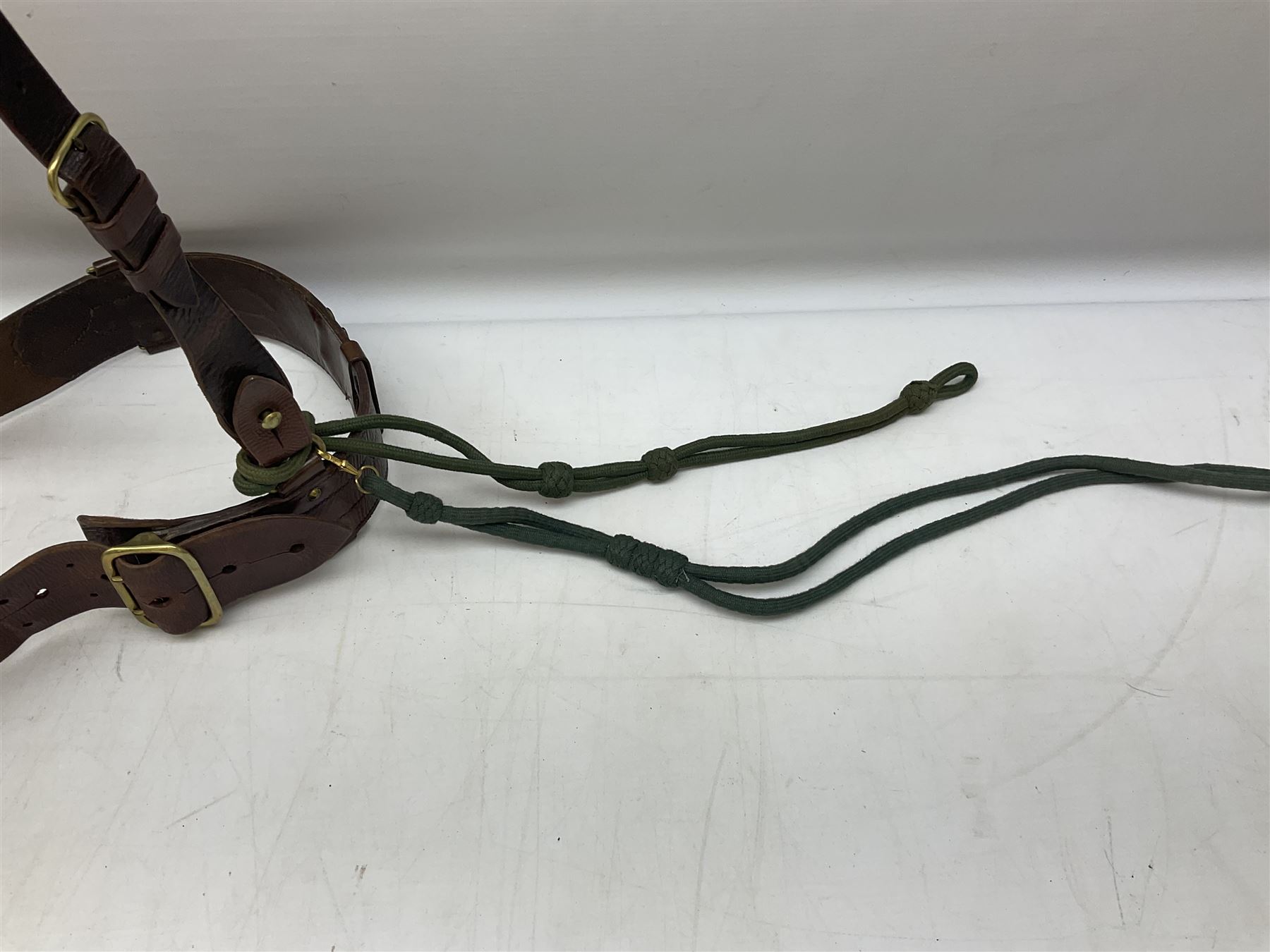 British Army Officers Sam Browne leather belt with shoulder strap; and webbing belt with Potter London Staybrite buckle for 19th Regiment of Foot (Green Howards) with various markings (2)
