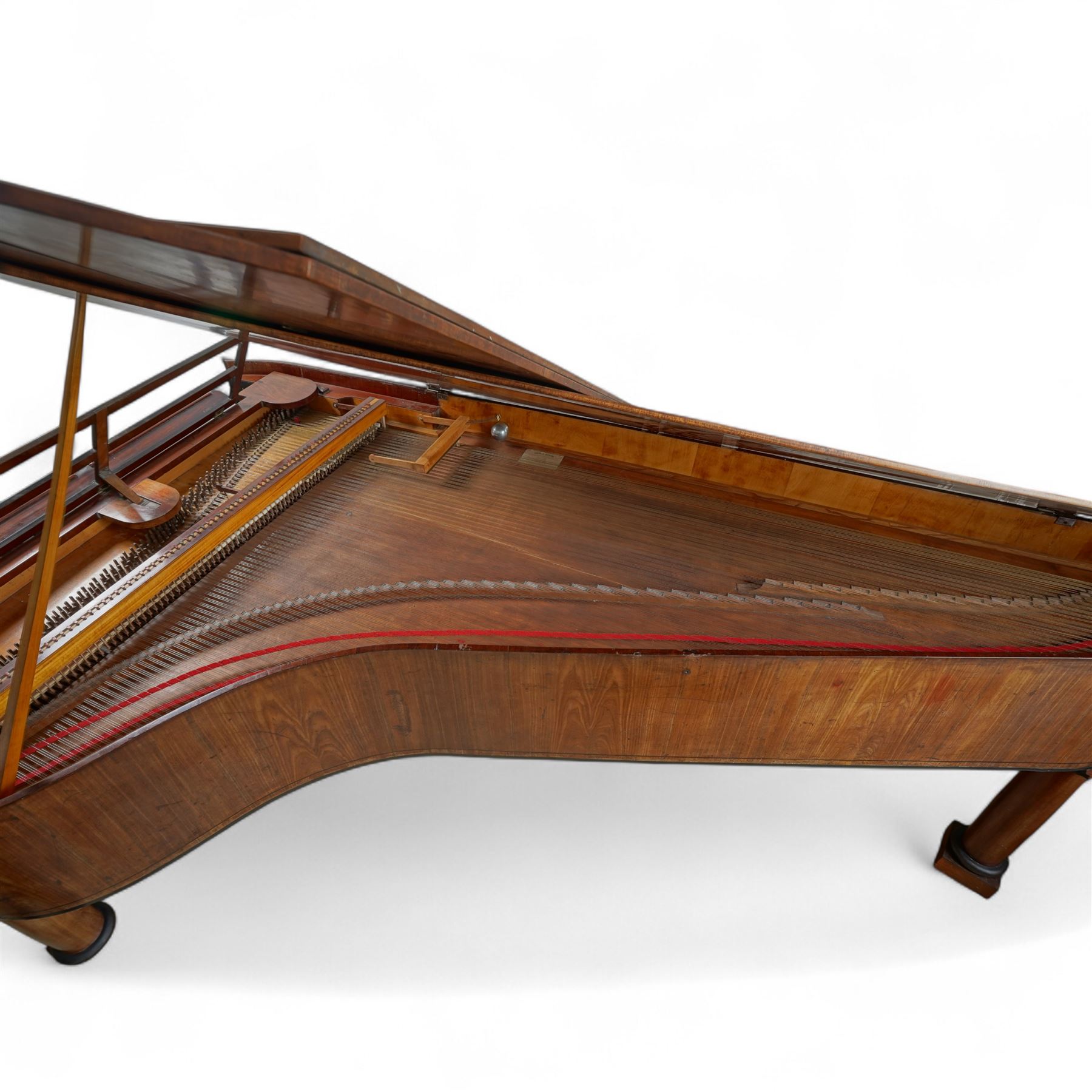 Austrian “Viennese” Grand Piano by Joseph Böhm c1820.
Straight triple strung, with a Viennese action and adjustable escapement rail, some new dampers and damper felt with leather covered hammers, string gauges marked on the wrest plank, soundboard appears to have been shimmed in places, bridge in good condition, possibly re-strung at some time with one tuning pin and two strings missing. Action with good repetition and damping, however some adjustment may be necessary to both the action and pedals. Six octave keyboard, with 78 keys C1-F7, with Ivory naturals and ebony sharps, lyre supported on a stretcher with seven pedals, Bells & Drum, Treble Sustain, Full Sustain, Piano & Pianissimo, Bassoon Stop and Una Corda. Adjustable open lattice music desk. Ebonised panel above the keys with maker name and decorative gilt mounts depicting imperial eagles, grapevines, scrollwork, and angelic trumpeters. Case raised on three circular columns with block supports. 
This instrument is typical of the type of piano being made in Vienna in the early 19th century and a type of piano possibly familiar to Beethoven during the period of the composers’ later compositions. This piano is thought to be one of the earliest known pianos by this maker and was discovered in Milan in the 1870’s. A retailer’s trade label from that period is attached to the soundboard.

Given the intricate nature of these historic instruments, specialist support will be available if required, to assist successful buyers with safe removal and onward handling. Price upon application. 

This item has been registered for sale under section 10 of the APHA Ivory Act Reference A2ZEXJGY