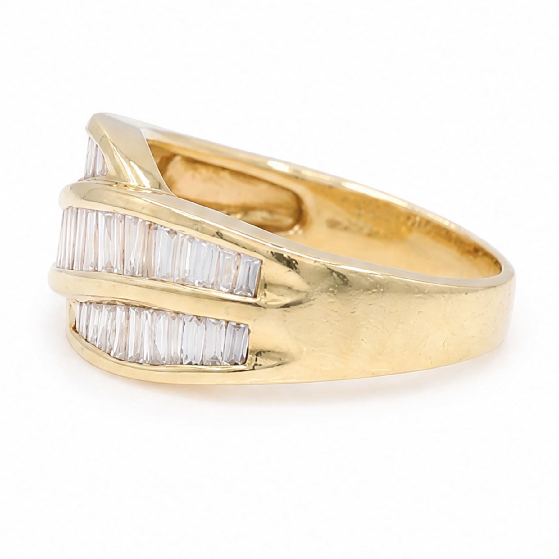 18ct gold diamond crossover ring, channel set with three rows of baguette cut diamonds, 1994