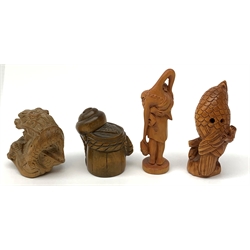 Four carved wooden Japanese netsukes, modelled as a dragon, two snails upon a log, a bird perched upon a branch, and a fisherman with figure upon his back, each signed beneath. (4). 