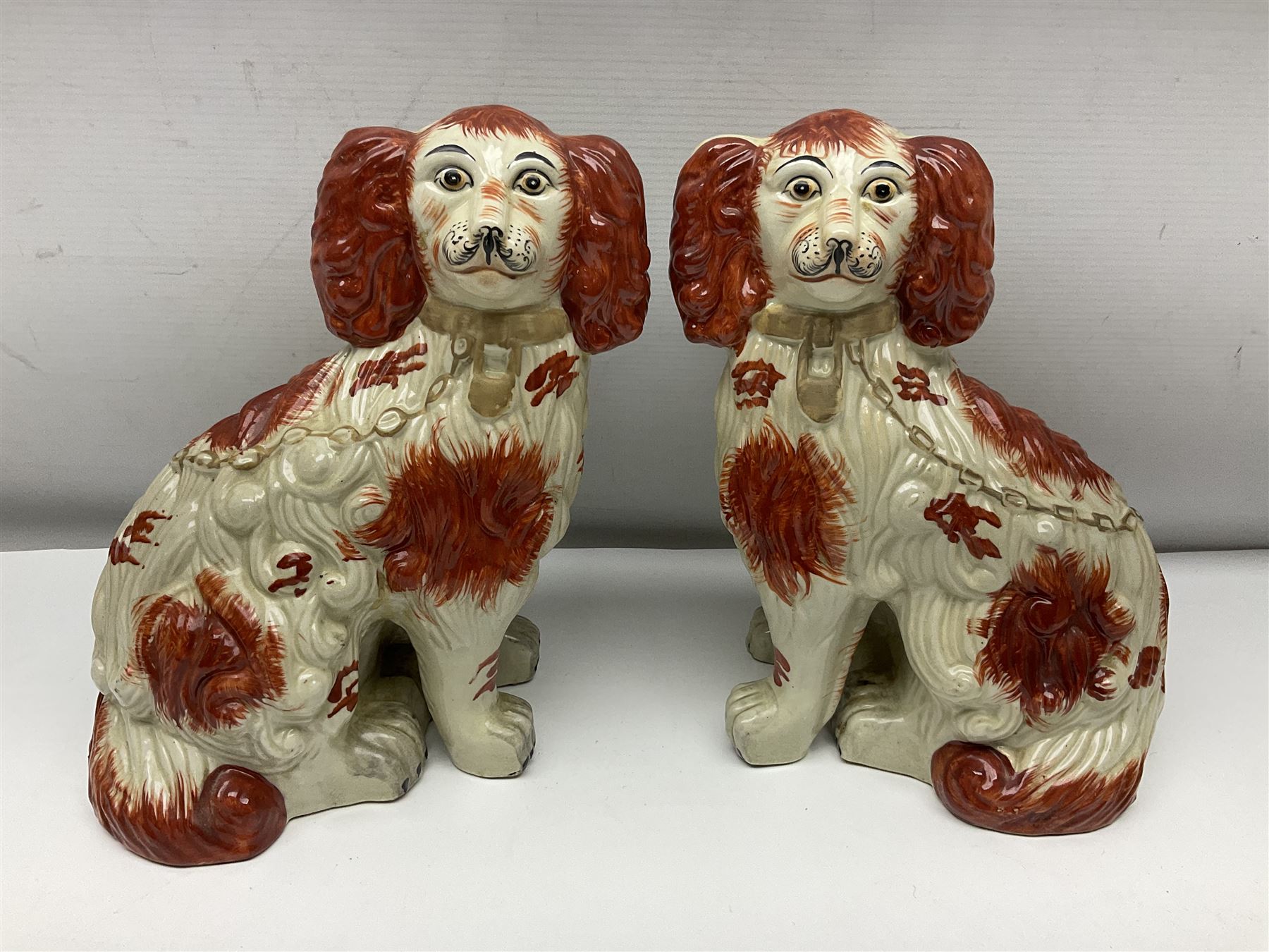 Two Pairs of Staffordshire style dogs, together with three other examples, largest example H27cm