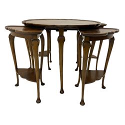 Mid 20th century figured walnut nest of tables, the centre table with shaped top and moulded edge on cabriole supports, with four nesting tables each with shaped undertier 
