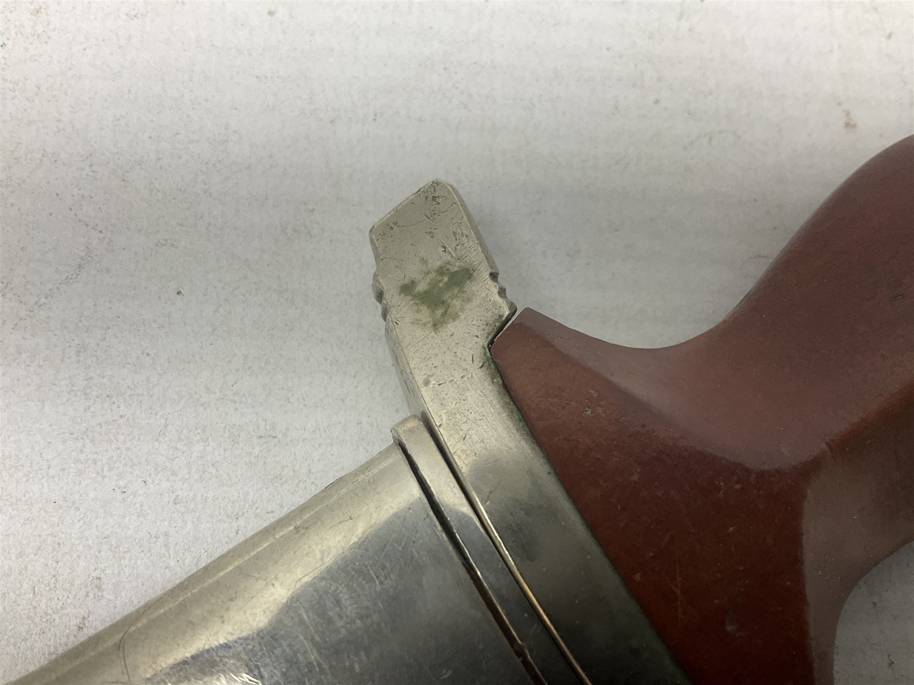 WW2 German SA dagger the 22cm double edged steel blade by G. Felix Gloriawerk Solingen inscribed 'Alles Fur Deutschland', the cross-piece impressed with the SA Gruppen mark Nm verso for Nordmark, wooden grip inset with eagle and SA emblem; in brown painted scabbard with nickel mounts L37cm overall