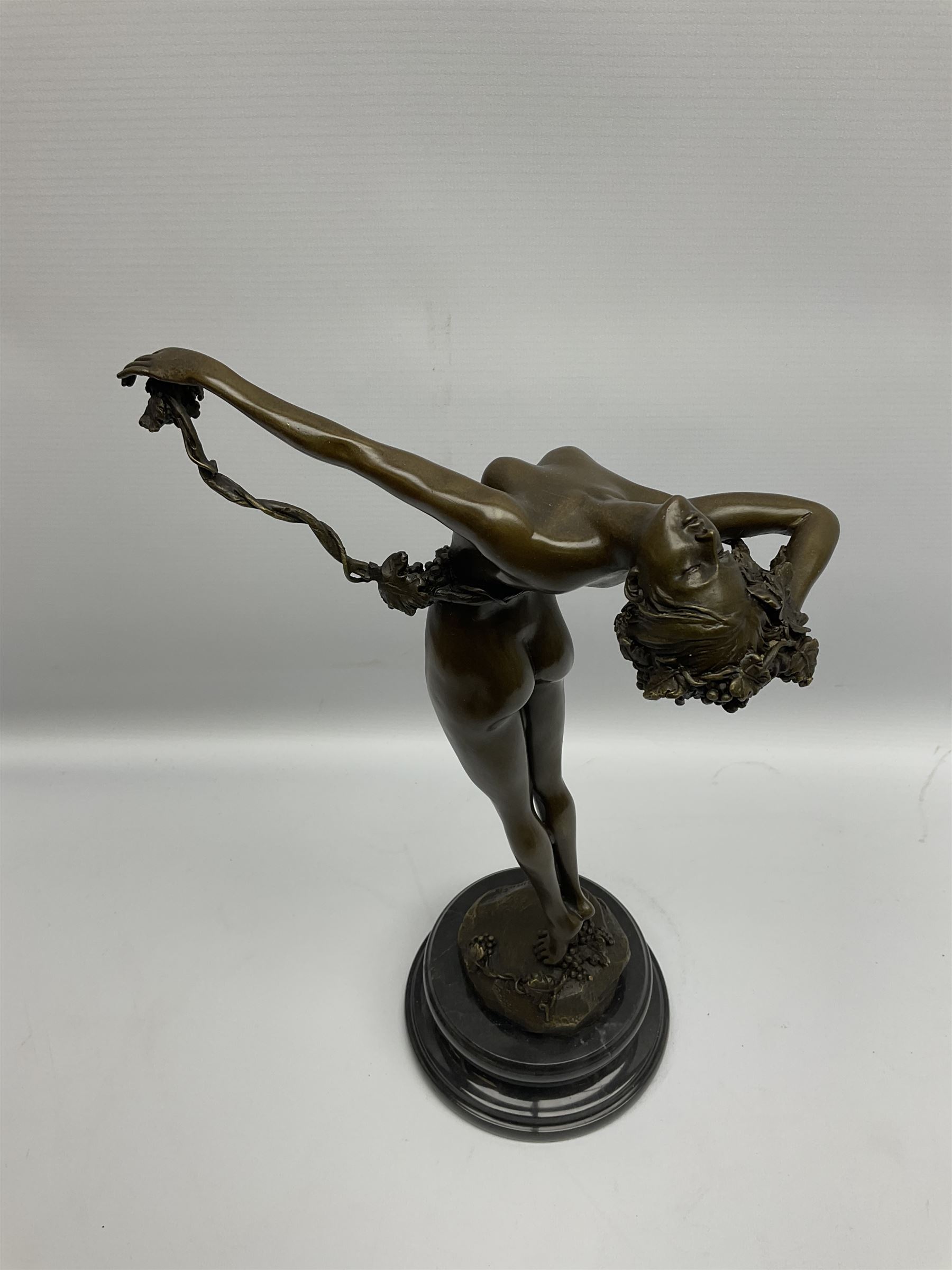 Bronze figure of a nude female holding a vine, after 'H. Frishmuth', with foundry mark on socle base, H38cm
