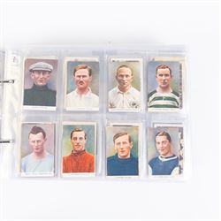Collection of Edwardian and later Football related trading and cigarette cards, including forty-nine of fifty 1906 Ogden's Football Club Colours, 1922 PALS Footall series, ninety of one hundred 1925 Gallaher Famous Footballers, complete set of forty-four 1926 Ogden's Captains of Association Football Clubs and Colours, complete set of fifty 1927 Players Football Caricatures by MAC,  complete set of fifty 1927 Players Football Caricatures by RIP,  complete set of fifty 1930 Players Association Cup Winners, complete set of 50 1933 Ogdens AFC Nicknames etc, housed in brown cigarette card album