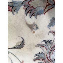 North East Persian Kashmar hand-knotted rug, ivory field with an all-over design of linked floral medallions and scrolling vines with a central circular medallion enclosed by multiple borders and a main broad madder field with palmettes and arabesques, 248cm x 145cm