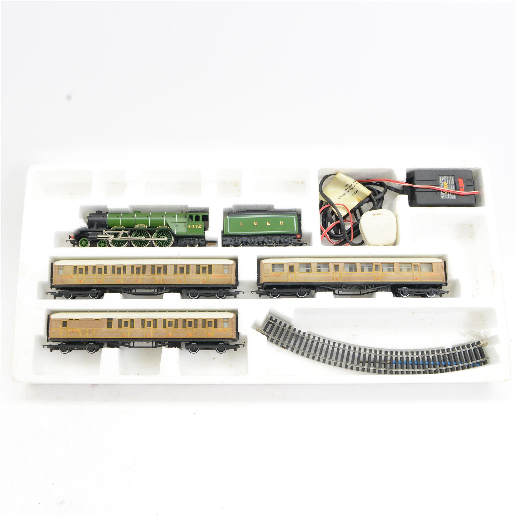 Hornby '00' gauge R580 'Task Force Action Set', including 0-6-0 diesel WD locomotive no. 17 in green livery, tank, rockets wagon and track, together with Hornby '00' gauge R548 'Flying Scotsman' Train Set, both boxed