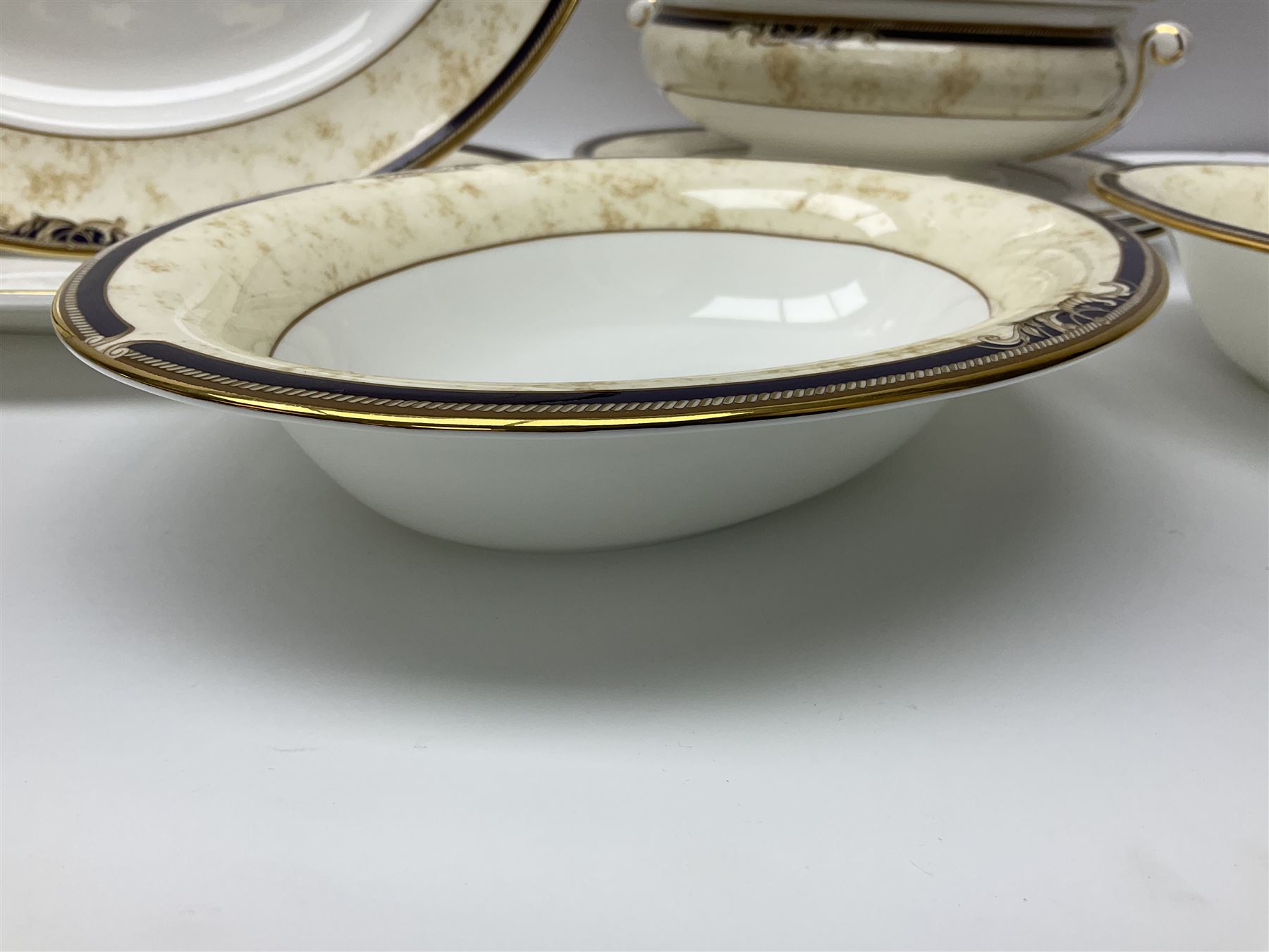 Wedgwood Cornucopia part dinner service, comprising six dinner plates, six soup bowls, six bowls, two serving platters, two oval dishes, covered serving dish, sauce boat and saucer (25)