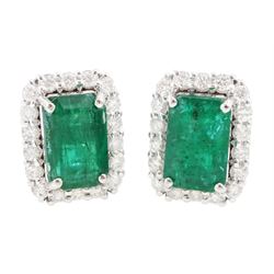 Pair of 18ct white gold octagonal cut emerald and round brilliant cut diamond stud earring...