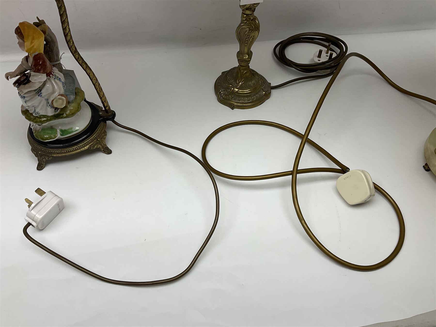 Green onyx and gilt metal table lamp decorated with puttos, together with gilt jardiniere stand and two other table lamps, stand H62cm