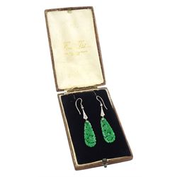 Pair of 18ct white gold Art Deco jade and diamond earrings, the pear shaped jade panels, with carved foliate decoration, suspending from milgrain set single and old cut diamond pendants, in velvet and silk lined box by Prouds Ltd, Sydney