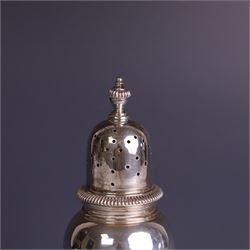 Mid 20th century silver sugar shaker, of typical baluster form, the removable pierced cover with urn finial, hallmarked William Comyns & Sons Ltd, London 1961