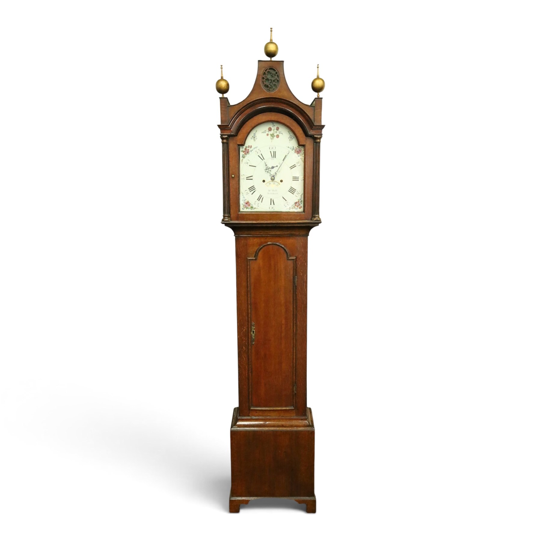John Hall of Beverley - George III oak eight-day longcase clock, the painted arched dial with subsidiary seconds and date aperture, floral decoration, the case with pagoda top, pierced fretwork panel, brass ball finials, fluted pilasters and arched trunk door