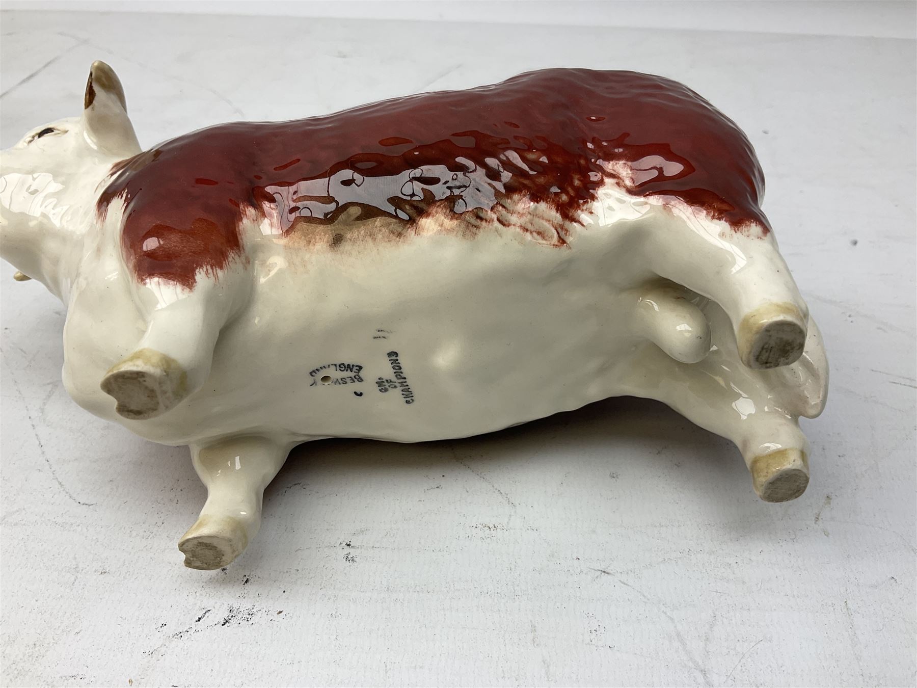 Three Beswick models comprising Hereford Bull no 949, 'CH Cutmil Cupie' Pug, and bay Shire horse, all with printed marks beneath