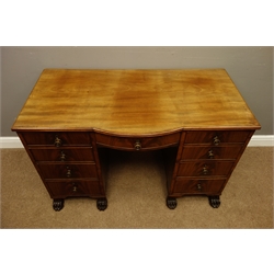  Regency period mahogany kneehole desk, reeded bow break front top above nine graduating figured drawers with scumbled paper linings, on carved paw feet, W115cm, H74cm, D59cm  
