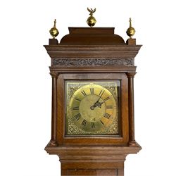 An 18th century chain driven 30-hr longcase clock in an oak case by James Pepper of Biggleswade c 1760, with a caddy top pediment and three (later) spun brass finials, blind fret to the front and square hood door with attached pilasters, slim trunk with a full length flat topped door on a rectangular plinth with applied skirting, 11” brass dial with chapter ring, Roman numerals, minute track and five minute Arabic’s, matted dial centre with decorative engraving and urn pattern spandrels, square date aperture with engraved date ring behind, countwheel striking movement, striking the hours on a cast bell. With pendulum and weight.
The Pepper family of Biggleswade were a prolific family of Bedfordshire clockmakers working from c1720-1889  
