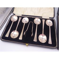 Set of six 1920s silver coffee spoons and a pair of sugar tongs, hallmarked William Suckling Ltd, Birmingham 1928, together with a similar set of spoons and tongs, hallmarked William Suckling Ltd, Birmingham 1928 and a set of six 1920s silver cake forks, hallmarked Cooper Brothers & Sons Ltd, Sheffield 1927, all within fitted cases