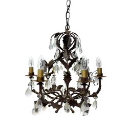 20th century distressed gilt tole chandelier, with six curved leaf clasped scrolling arms and frame, hung with lustre drops, approximately H50cm