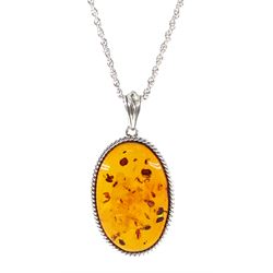Silver oval Baltic amber pendant necklace