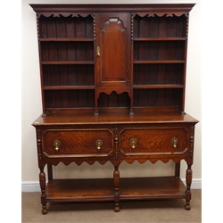  Early 20th century oak potboard dresser, raised three tier plate rack flanked by single cupboard above two drawers, turned supports, W154cm, H196cm, D54cm  