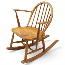 Ercol - two elm and beech rocking chairs, comprising Model 435 ‘Goldsmith’s’ rocking chair with tall spindle back and shaped crest rail, (H 120cm, W 49cm)and Model 470 ‘Windsor Tub’ rocking chair with rounded hoop back, both with shaped elm seats and curved rockers (H 73cm, W 59cm)