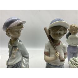 Four Lladro figures, comprising The Wanderer no 5400, Boy with Yacht no 4810, Can I Play? no 7610 and My Buddy no 7609, largest example H23cm
