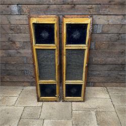 Pair of 19th century stained pitch pine windows, glazed with blue glass and star panels en...