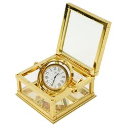 Sewills of Liverpool gilt gimbal mounted desk clock with white dial in brass and bevelled glass square case 8cm