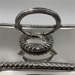 Early 20th century silver entree dish and cover, of rectangular form with shaped corners and oblique gadrooned borders to base and cover, the cover with loop 'bamboo' handle, hallmarked Thomas Bradbury & Sons Ltd, Sheffield 1930, including handle H10.5cm L24.5cm