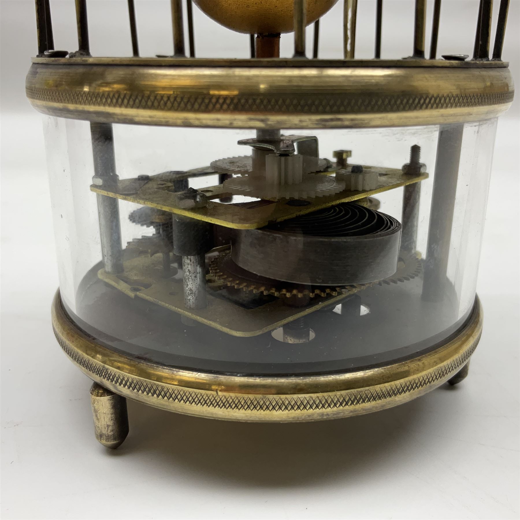 Automation bird cage clock of predominantly brass construction with central rotating orb and two birds with feathered decoration, H19cm