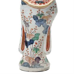 Large Japanese Imari porcelain figure, modelled as a Bijin, wearing a long kimono decorated with apple blossom and leafy branches on a white ground, with gilt detailing, possibly Edo period, H63cm