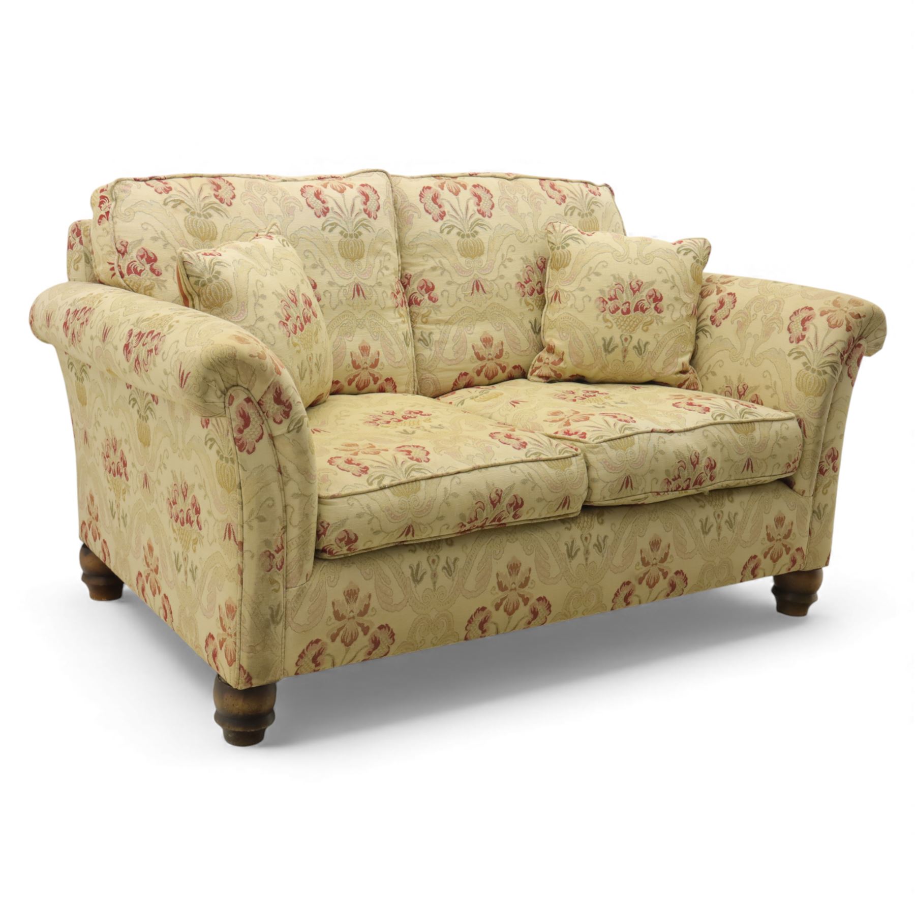 Late 20th century two seat sofa upholstered in floral beige and red fabric, turned supports 