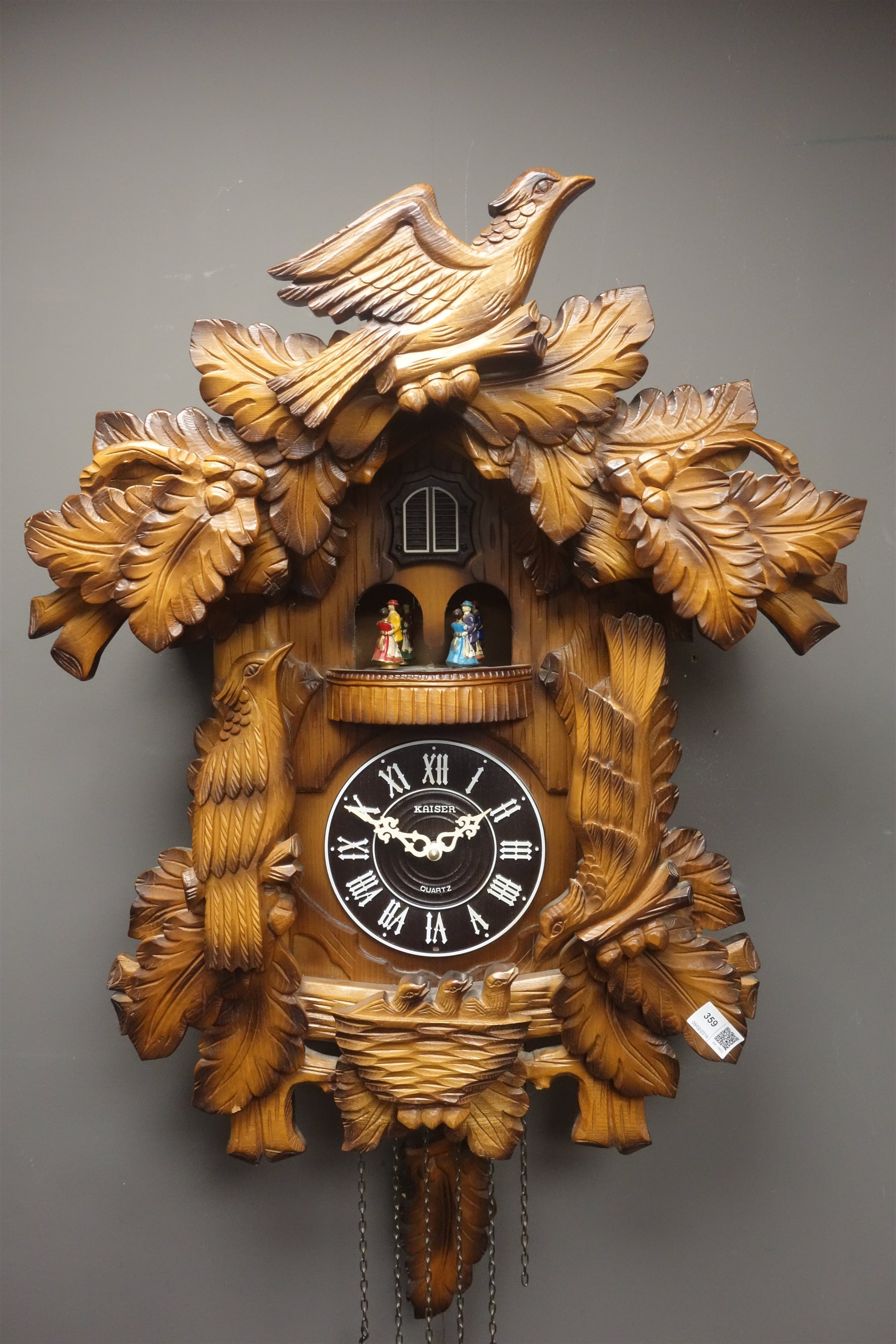 Large 'Kaiser' Black Forest type cuckoo clock, case carved with birds