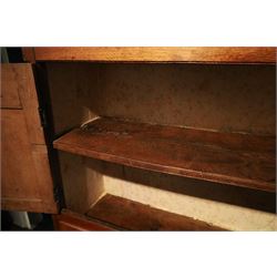 18th century oak larder cupboard, projecting moulded cornice over two panelled doors with shaped arched fielded panels, three short dummy drawers above base fitted with two short and one long drawer, turned handles, on bracket feet