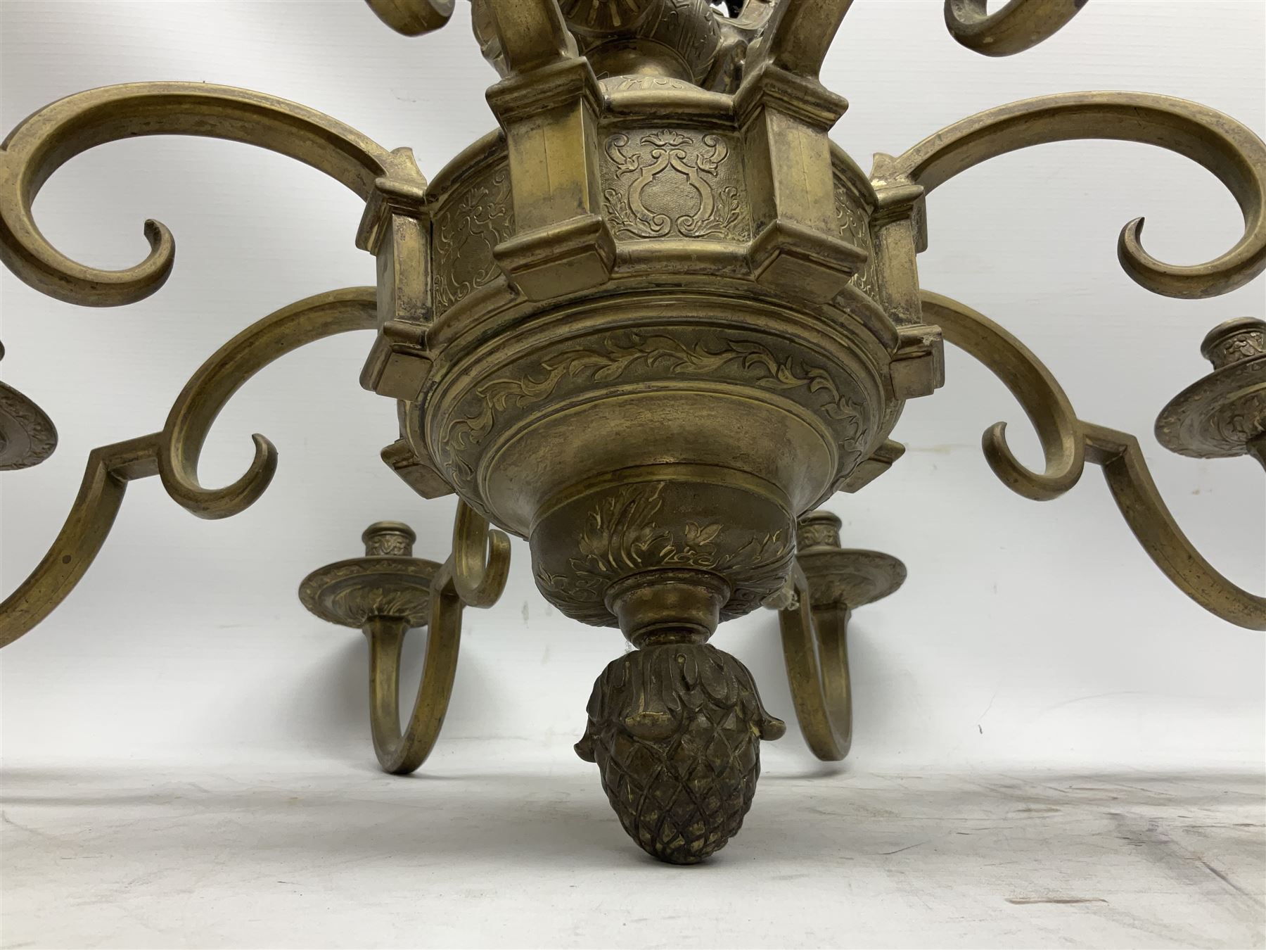 20th century heavy brass eight branch electrolier, detailed with putti masks, approximately H60cm W71cm