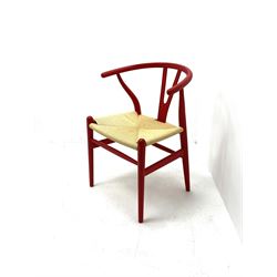 After Hans Wegner - 'Wishbone' style armchair with deep red finish and corded seat 