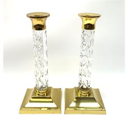 A pair of Waterford lead crystal cut glass and brass mounted candlesticks, H27cm. 