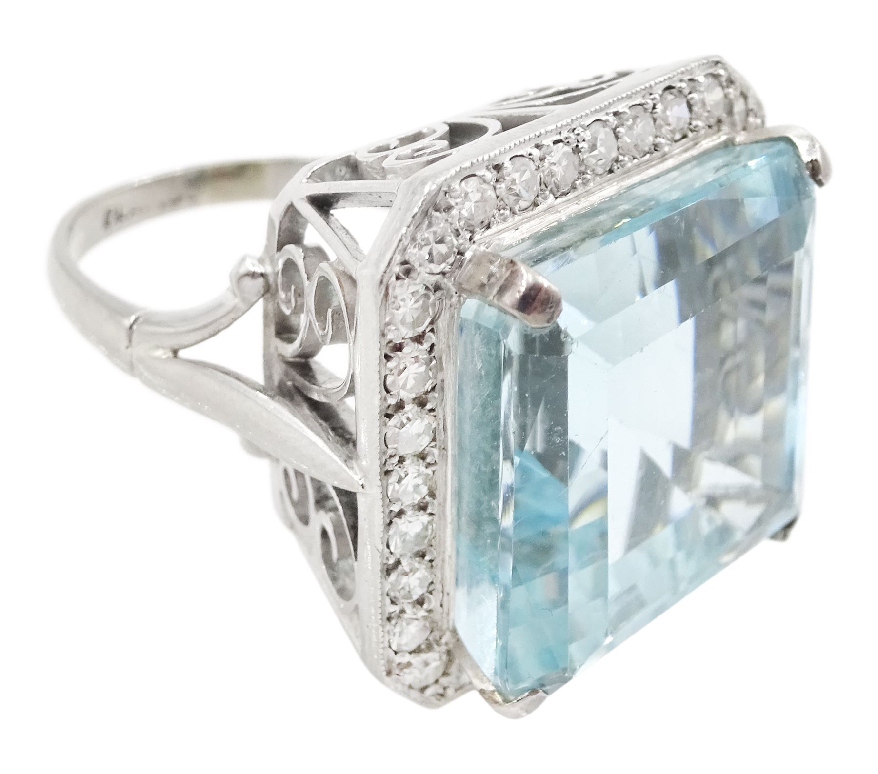 White gold square cut aquamarine and single cut diamond cluster ring, with fancy openwork gallery, aquamarine approx 26.45 carat, total diamond weight approx 0.75 carat