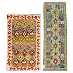 Two Chobi flatweave kilims, comprising a runner with a central row of medallions in yellow...
