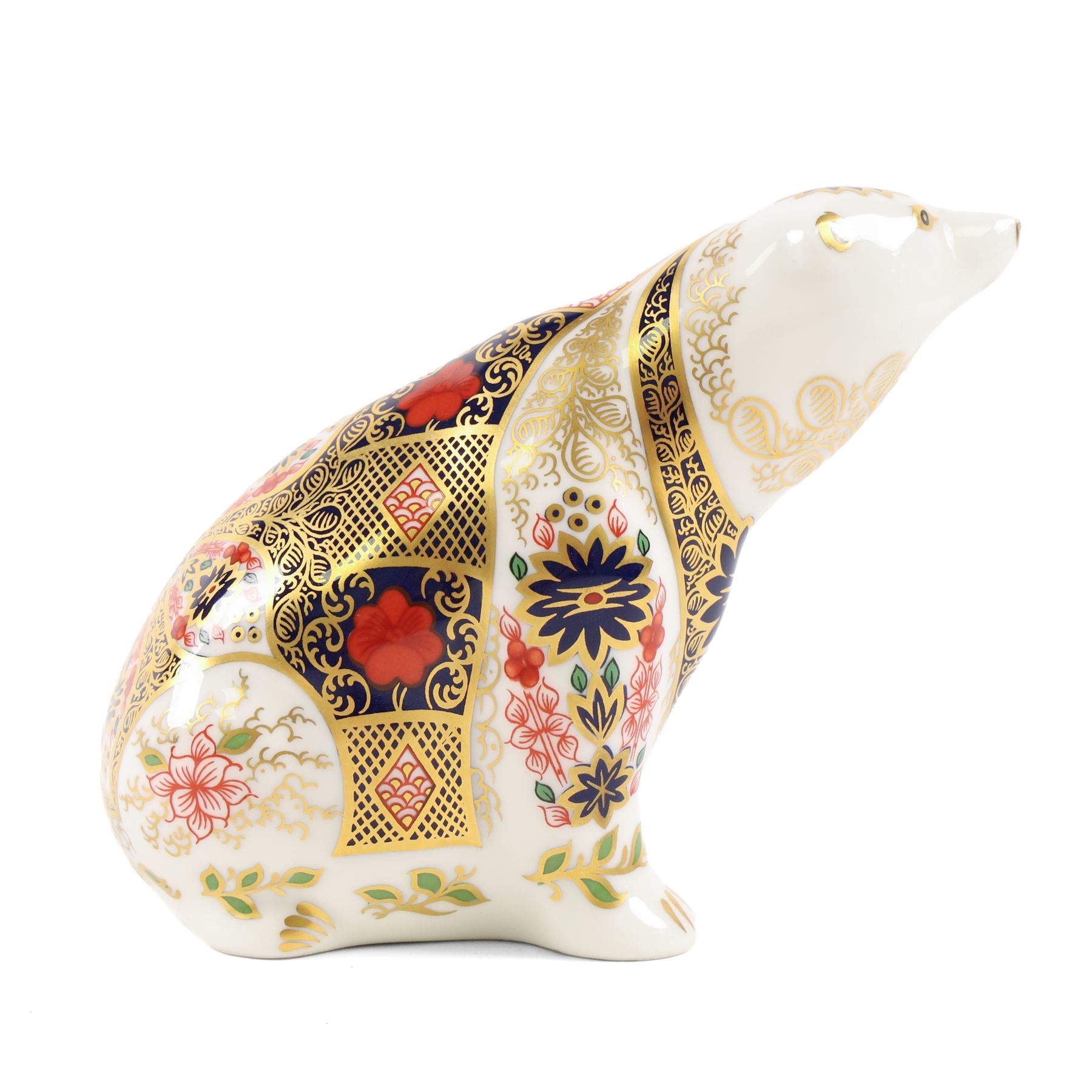 Two Royal Crown Derby paperweights comprising Imari Polar Bear with gold stopper and Sleeping Dormouse, with gold stopper  